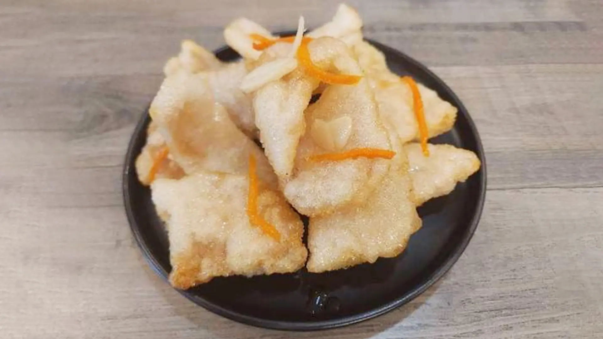 Crispy - fried pork slices garnished with thin strips at Mala Mini Restaurant in Palisades Park.